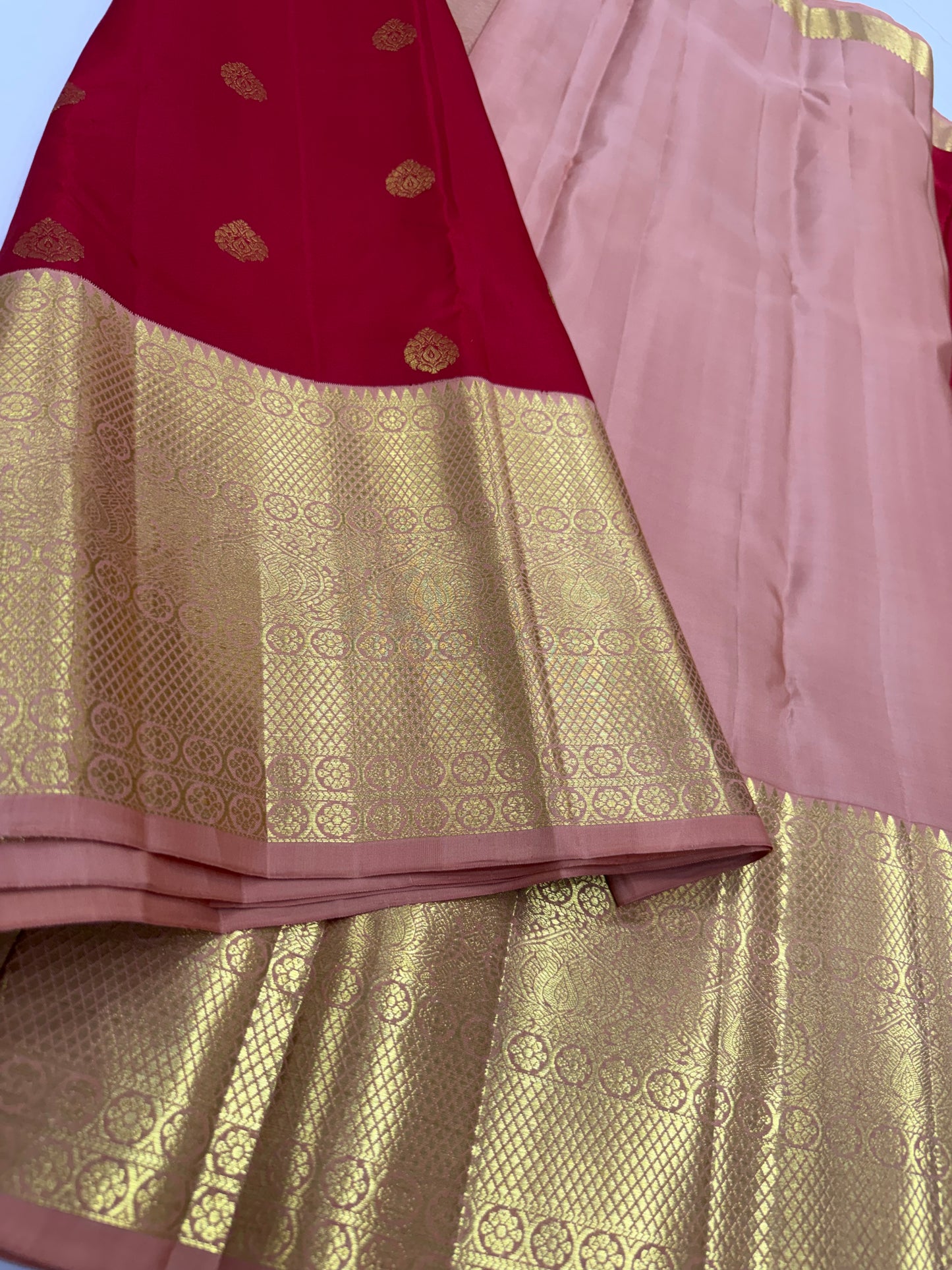 Red Saree with Traditional Motifs and Peach Pink Kanchi Border