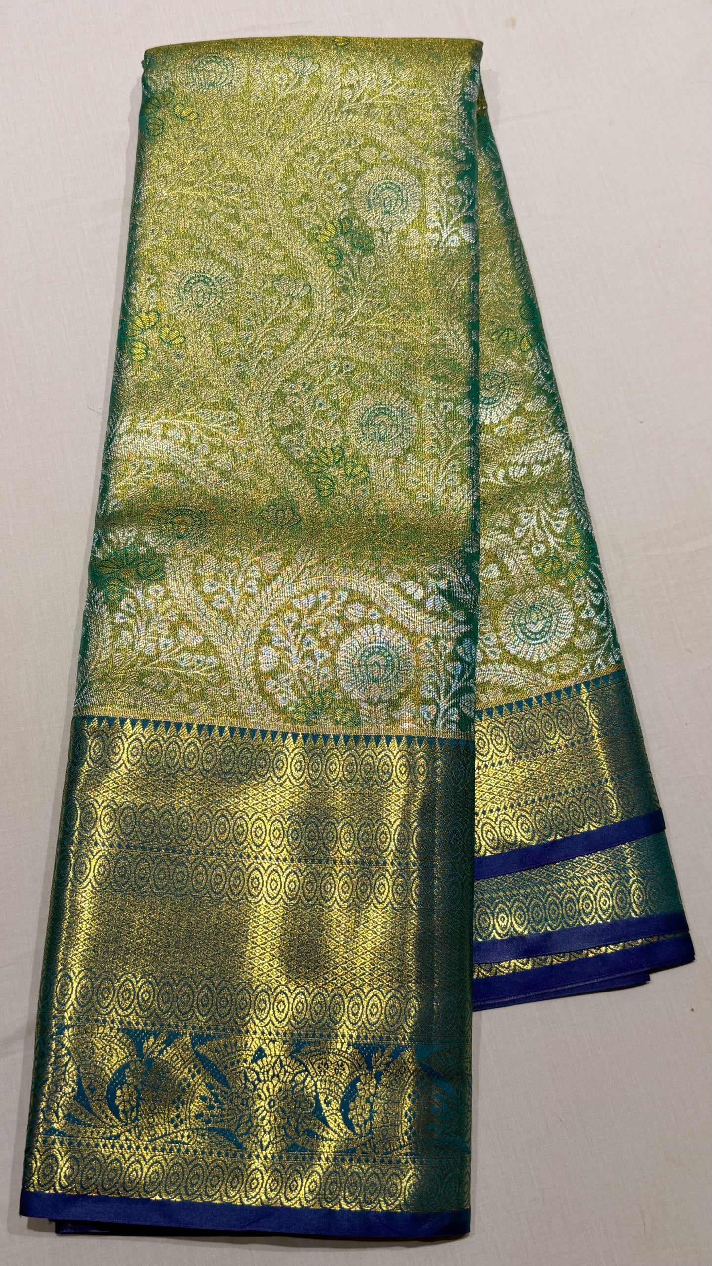 Green and gold Semi Kanchipattu sarees with  traditional  border