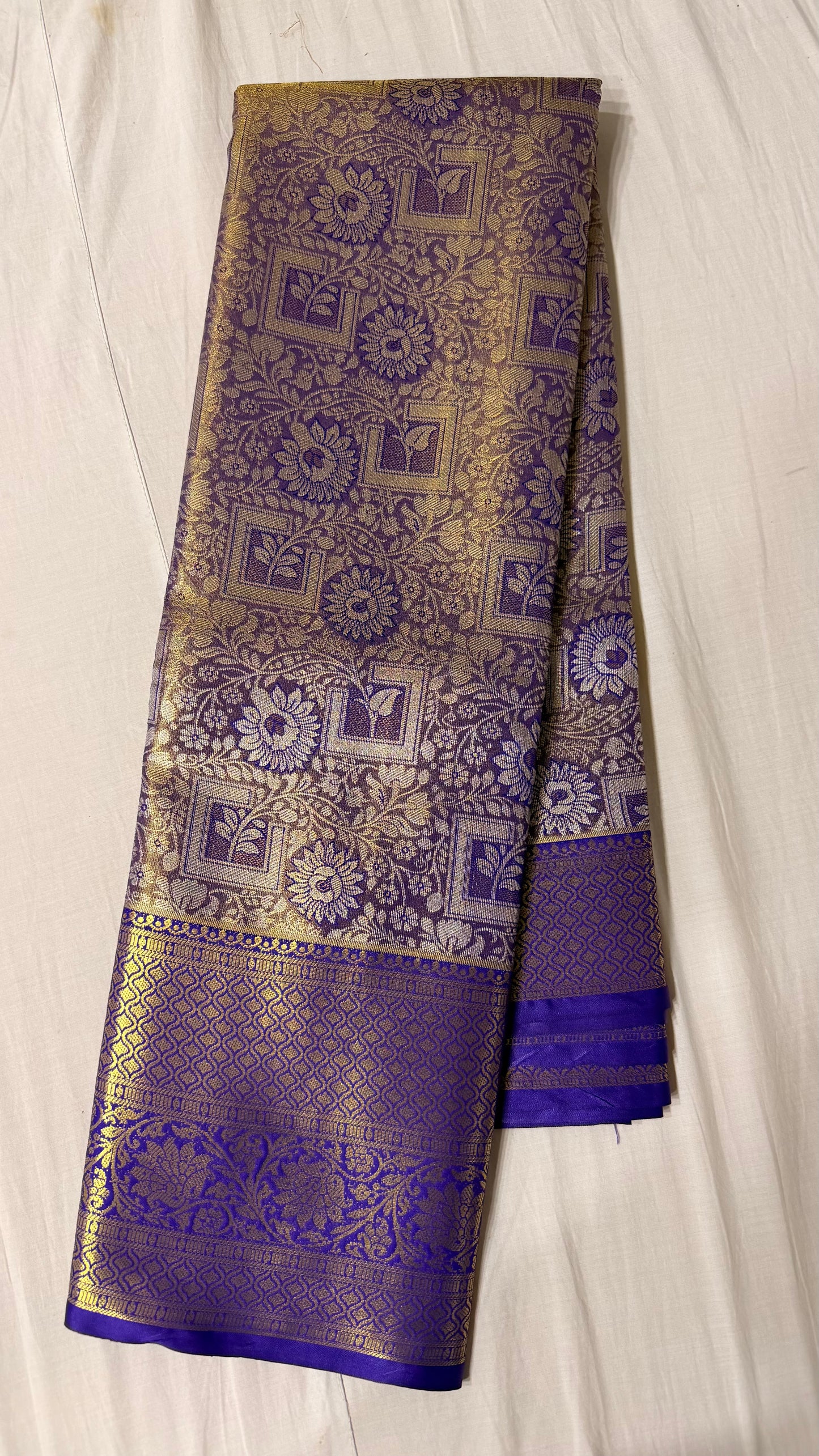 Purple and gold Semi Kanchipattu sarees with blue border