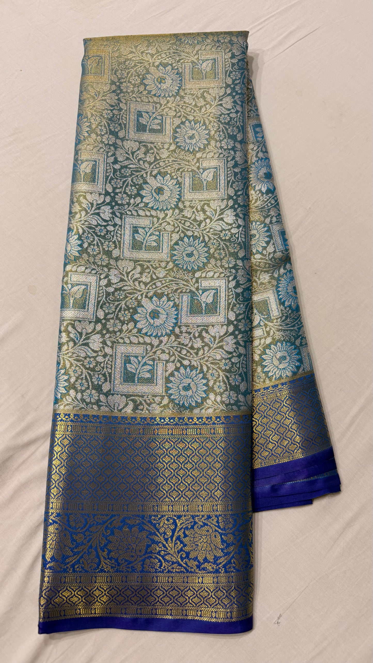Green silver Semi Kanchipattu sarees with blue traditional  border
