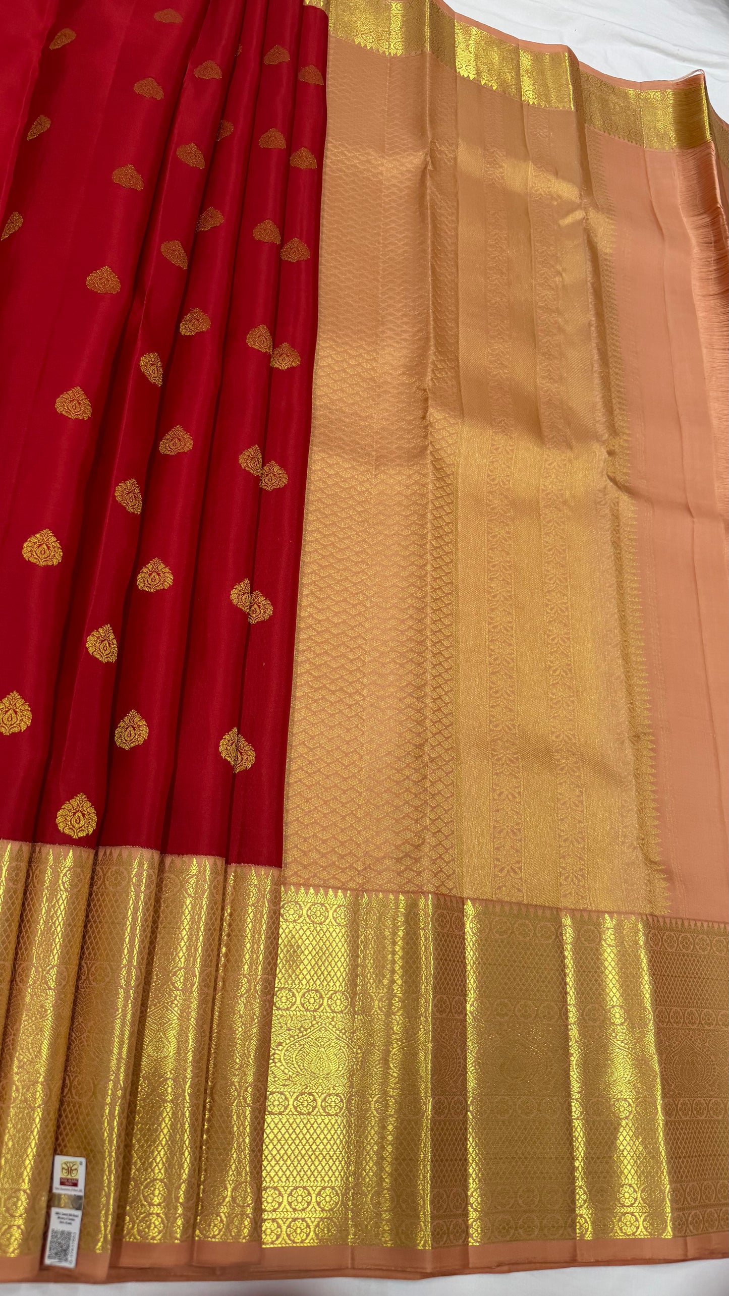 Red Saree with Traditional Motifs and Peach Pink Kanchi Border
