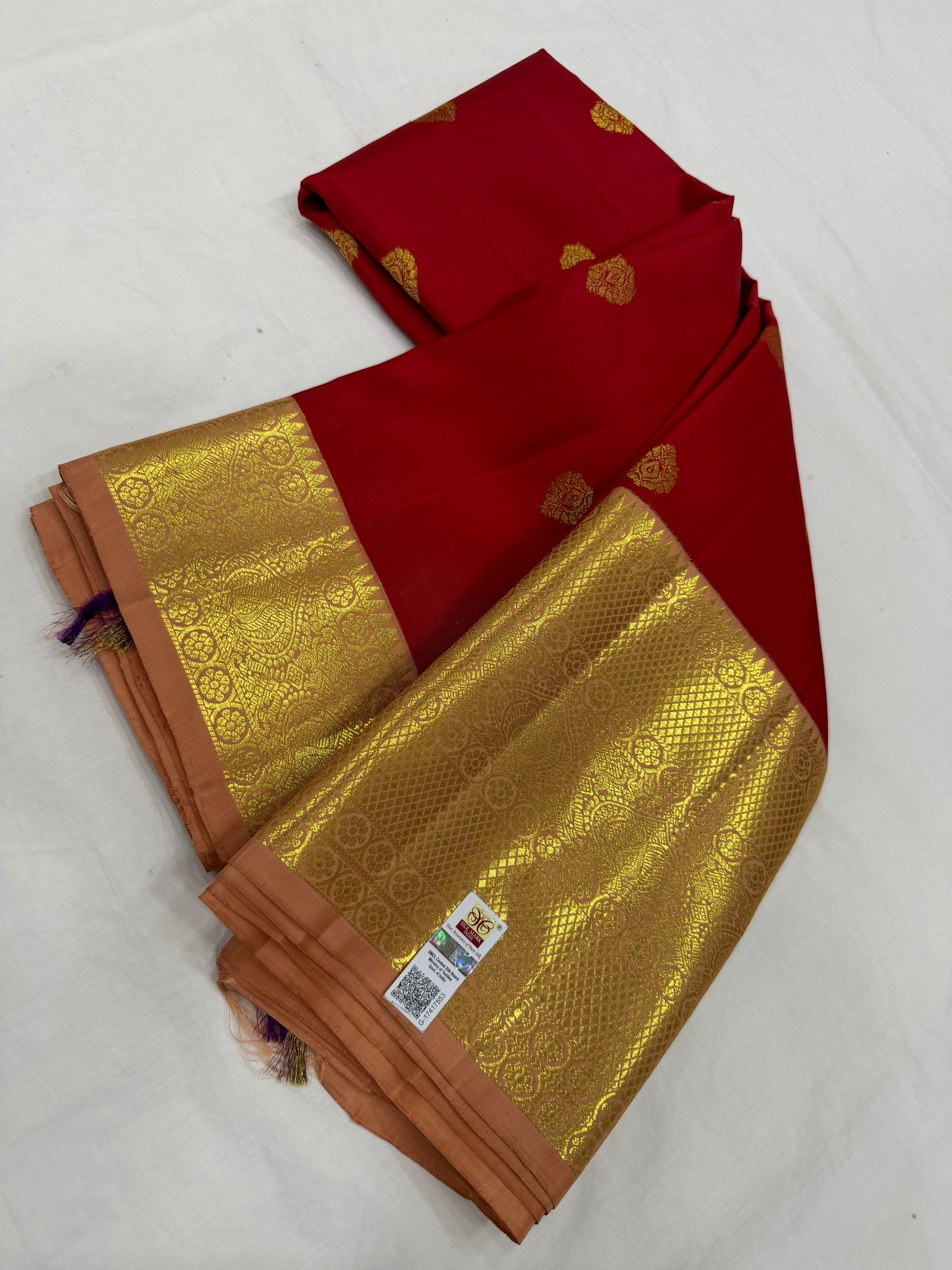 Red Saree with Traditional Motifs and Peach Pink Kanchi Border
