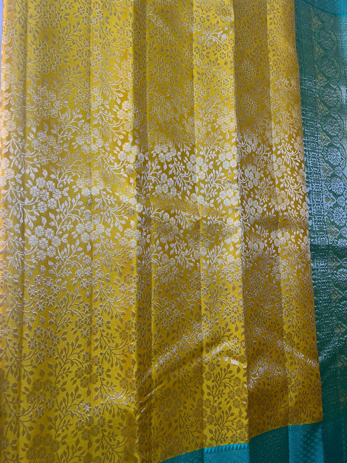 Mustard Yellow Brocade Pure Kanchipattu Saree with Sea Green Meenakari Border and 1 Gram Silver Zari