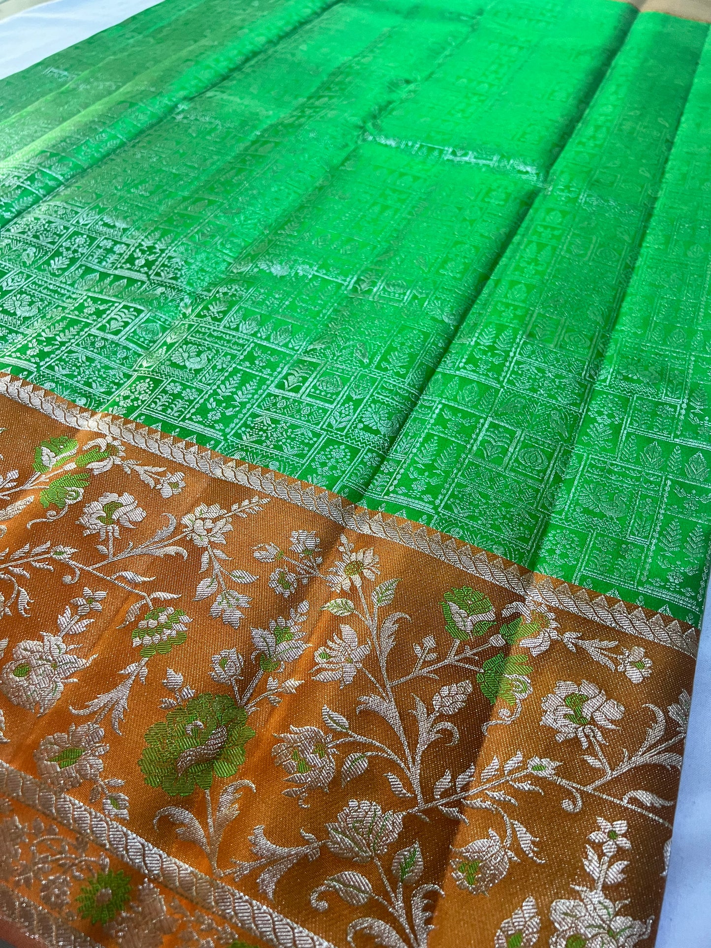 Premium Parrot Green Kanchipattu Saree with Orange Meenakari Border & Silver Zari Detailing