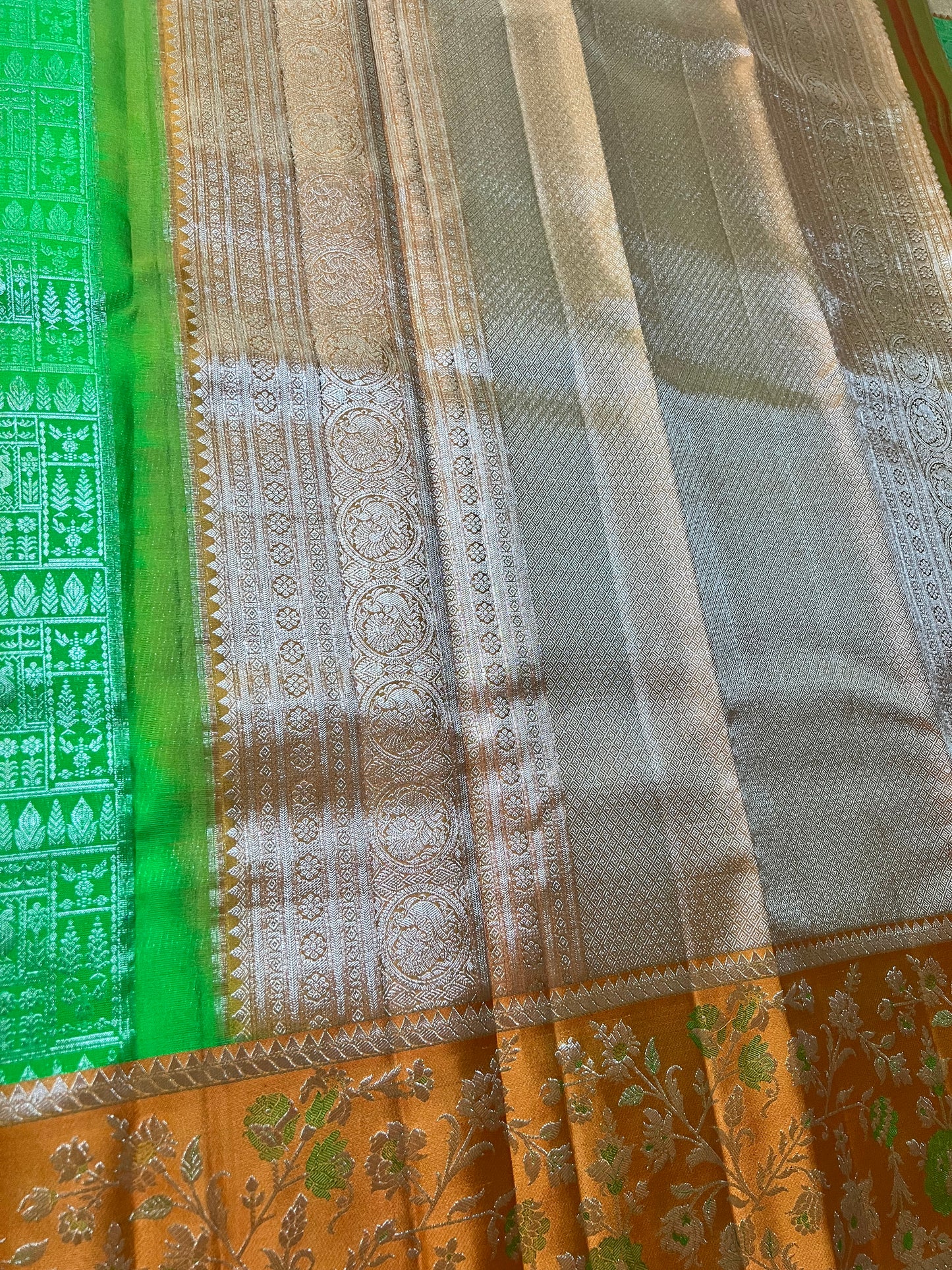 Premium Parrot Green Kanchipattu Saree with Orange Meenakari Border & Silver Zari Detailing