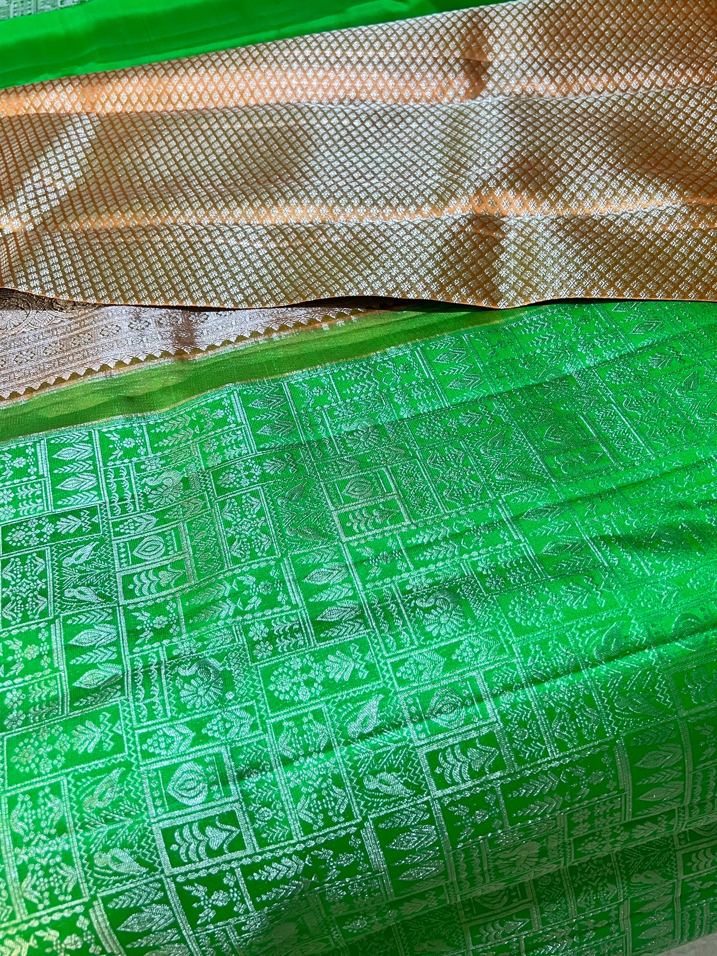 Premium Parrot Green Kanchipattu Saree with Orange Meenakari Border & Silver Zari Detailing