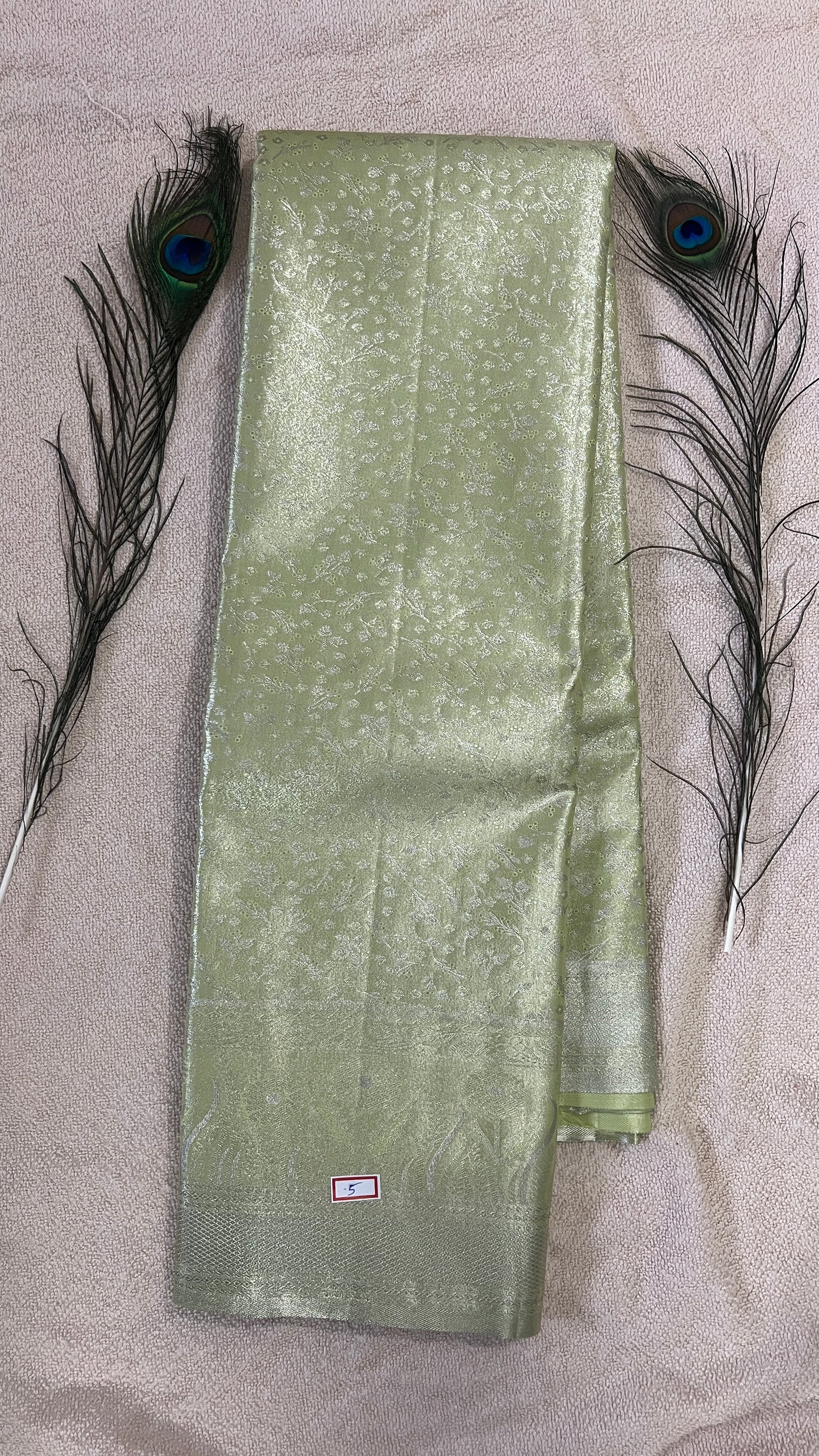 Pastel Pistachio Green and silver Semi Kanchipattu silk sarees with self traditional border