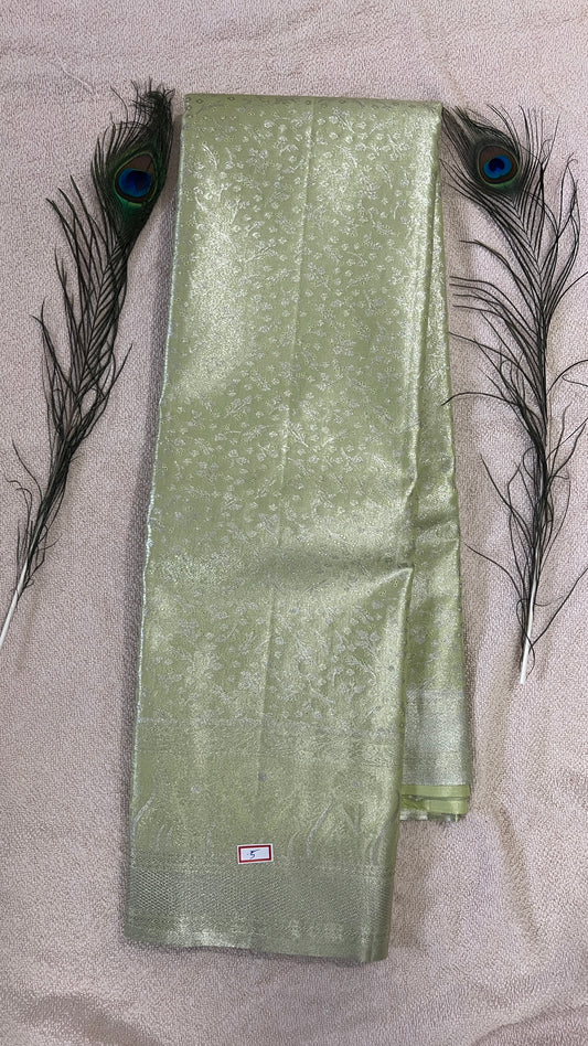 Pastel Pistachio Green and silver Semi Kanchipattu silk sarees with self traditional border