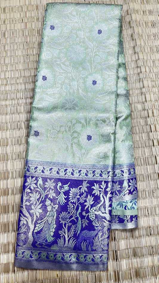 Light green Semi Kanchipattu sarees with  with blue and white patterns traditional Meenakari border