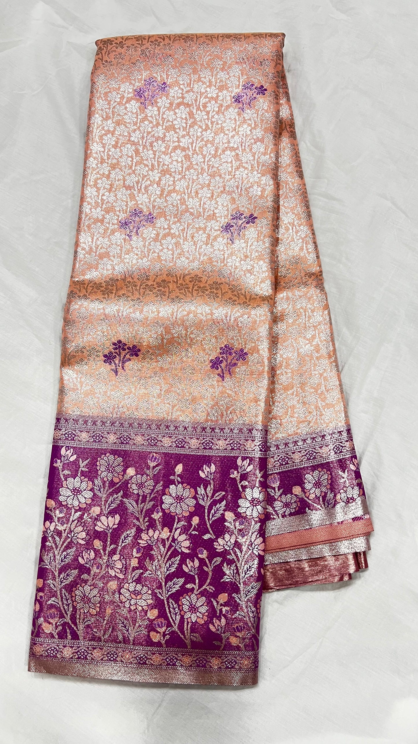 Orange Semi Kanchipattu sarees with traditional Meenakari border